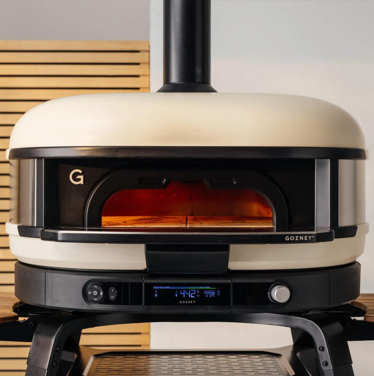 Gozney oven with digital display on a wooden surface